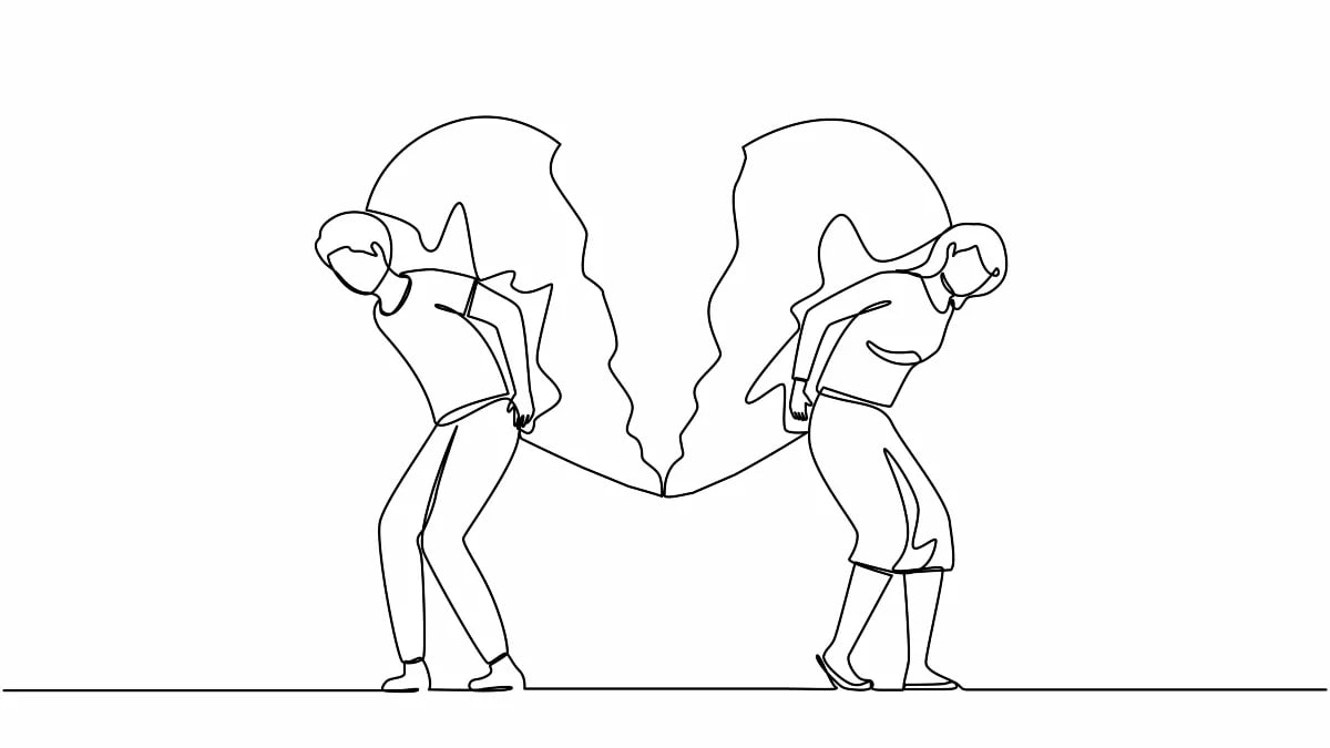 Two people moving away from each other with a broken heart between them
